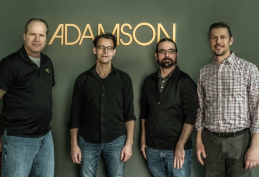 Adamson completes management revamp